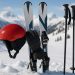 Skier demonstrating safe techniques on snowy slope to minimize injury risk while skiing