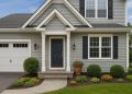 Beautifully landscaped front yard with new paint, modern lighting, and lush green plants